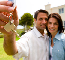Man and woman holding keys