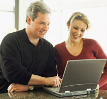 Man and woman using laptop