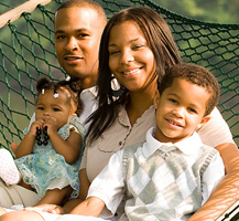 Family sitting on a hammock
