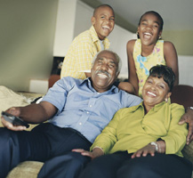 Family laughing and posing for picture