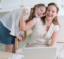 Woman and girl with laptop