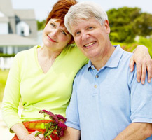 Woman and man posing for picture