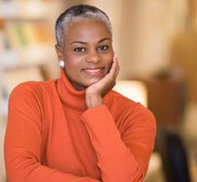 Woman in orage sweater smiling