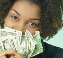 Woman holding a bunch of money