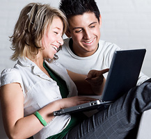 Woman and man using laptop