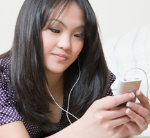 Young woman listening to iPod