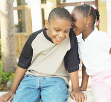 Boy and girl playing outside